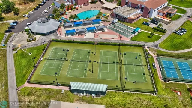 a kitchen with a sink a stove and a wooden cabinets