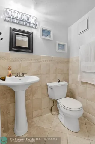 a bathroom with a toilet and a sink