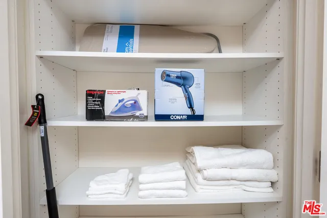 a living room with furniture and air hockey table