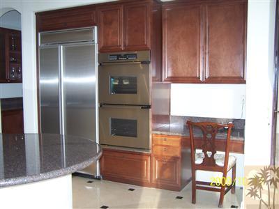 184 Loch Lomond Road Rancho Mirage, CA 92270 - Photo 8 of 13 a kitchen with granite countertop a refrigerator and a stove