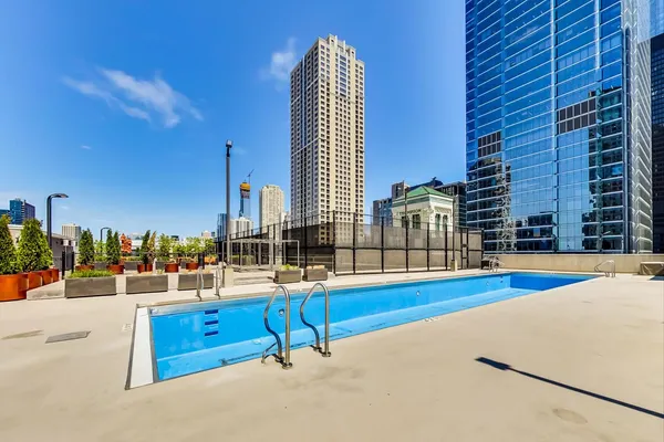 a view of a swimming pool with a lounge chair