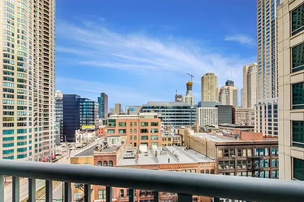 a view of a tall buildings from a balcony