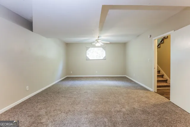 an empty room with a empty space and windows