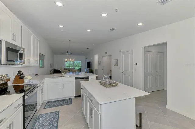 a kitchen that has a sink and a stove in it