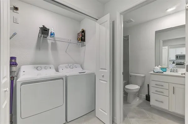 a view of bathroom with a washer and dryer