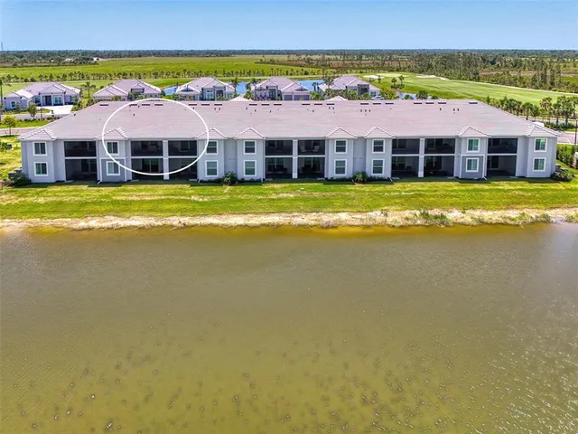 a view of a house with a garden and a large pool