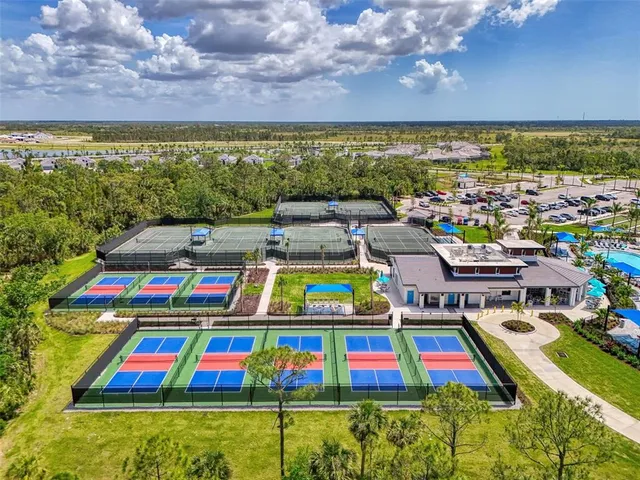 an aerial view of a house with a big yard