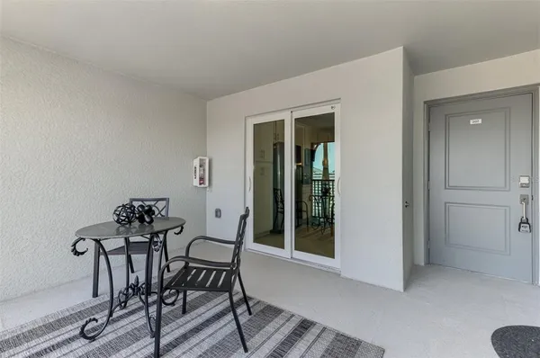 a view of a dining room with furniture and window