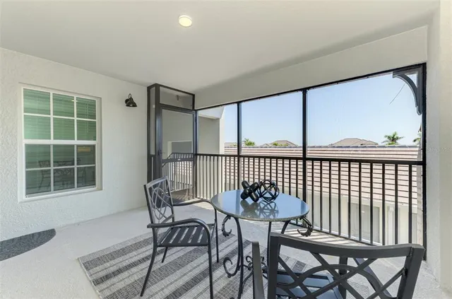 a front view of a house with a table and chairs
