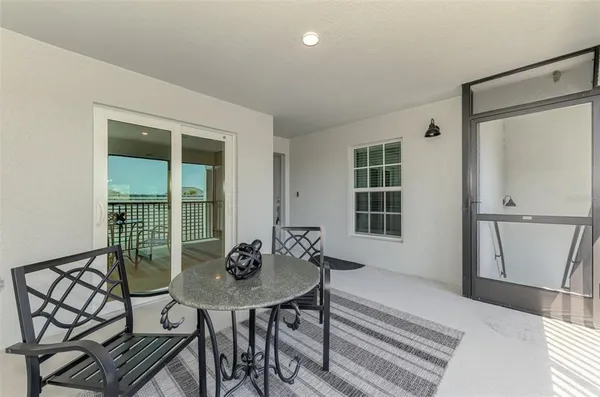 a view of a dining room with furniture and window