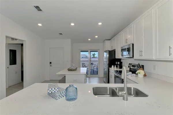 a bedroom with furniture and a sink