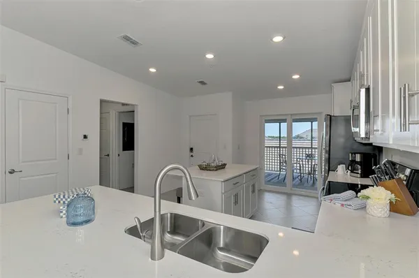 a kitchen with sink and window