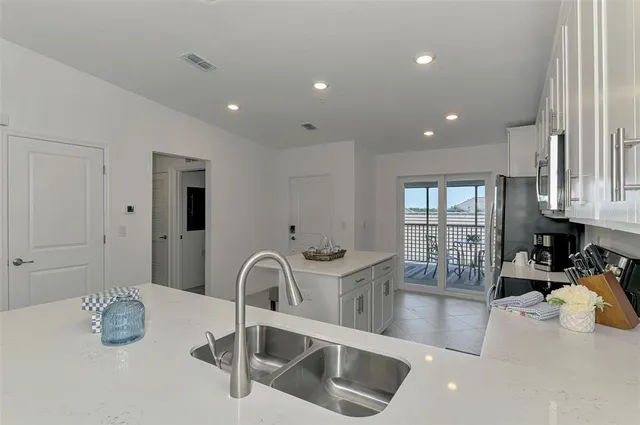 a kitchen with sink and window