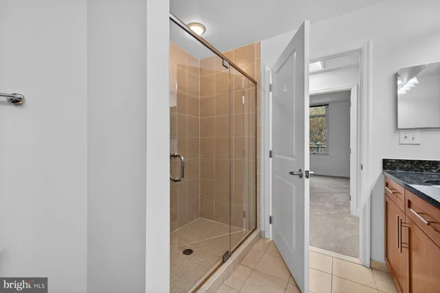 a bathroom with a shower and a sink