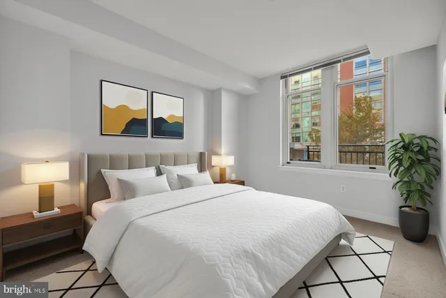 a bedroom with a bed and window