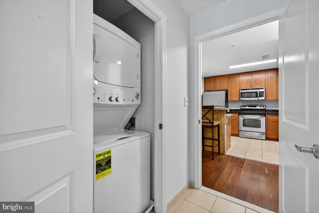 a view of a kitchen and an entryway
