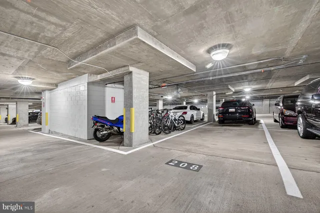 a view of parking area with parked cars