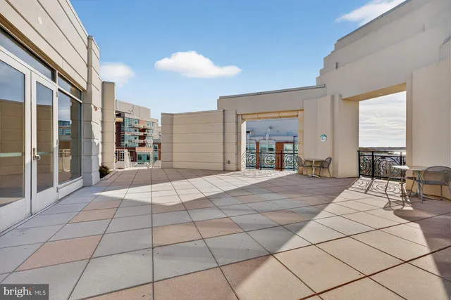 a large bedroom with a large bed and a large window