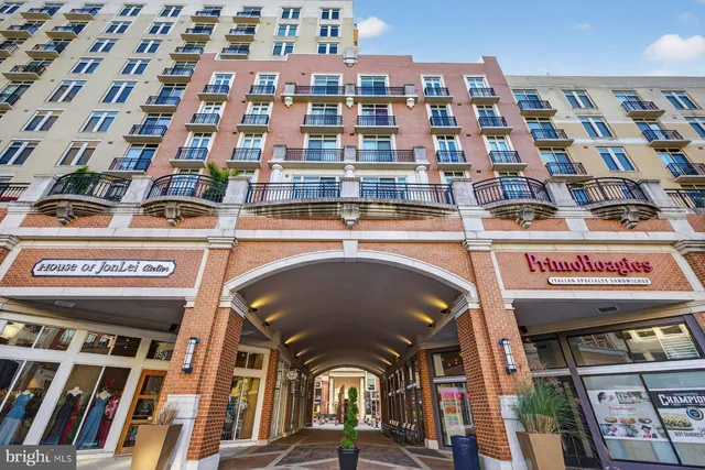 a view of a building with retail shops