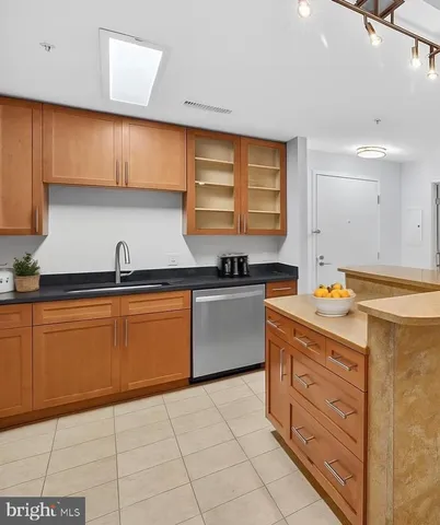 a kitchen with stainless steel appliances granite countertop a sink and cabinets