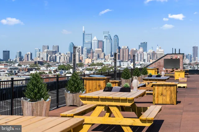 a view of a city with lawn chairs