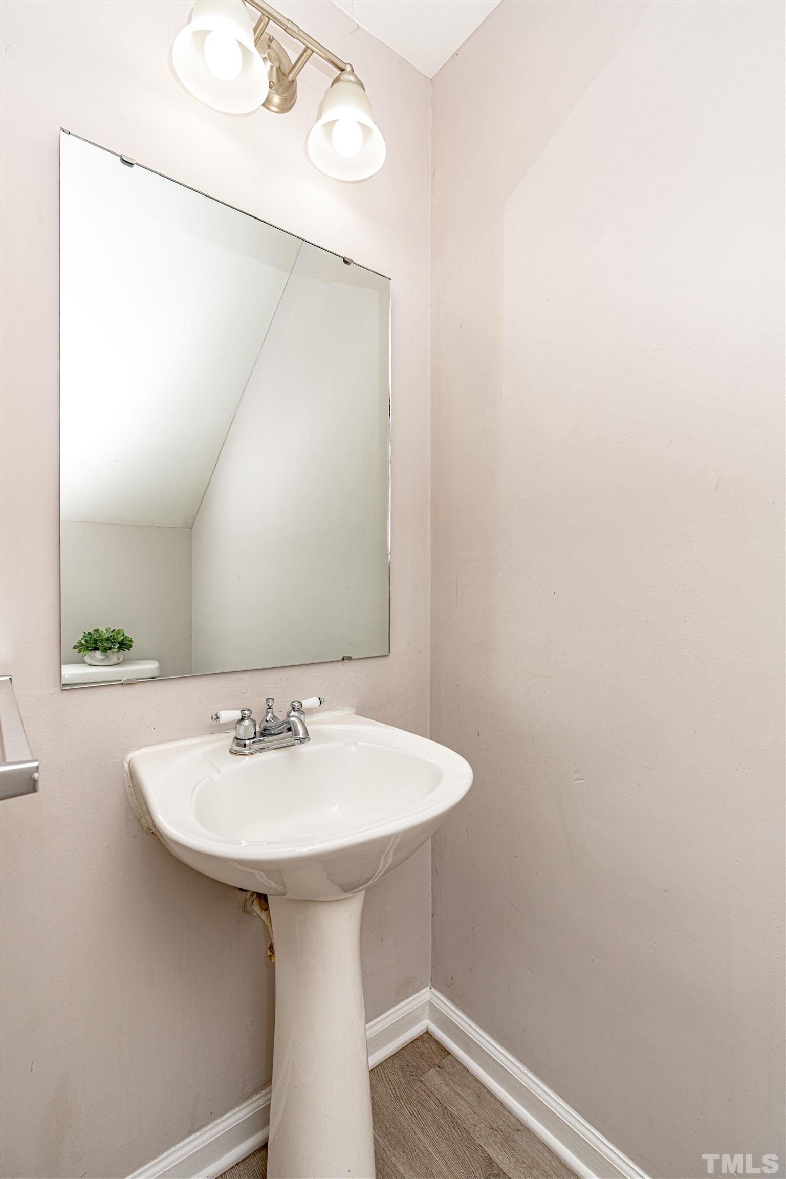 1722 Fox Hollow Drive Raleigh, NC 27610 - Photo 11 of 18 a bathroom with a sink and a mirror
