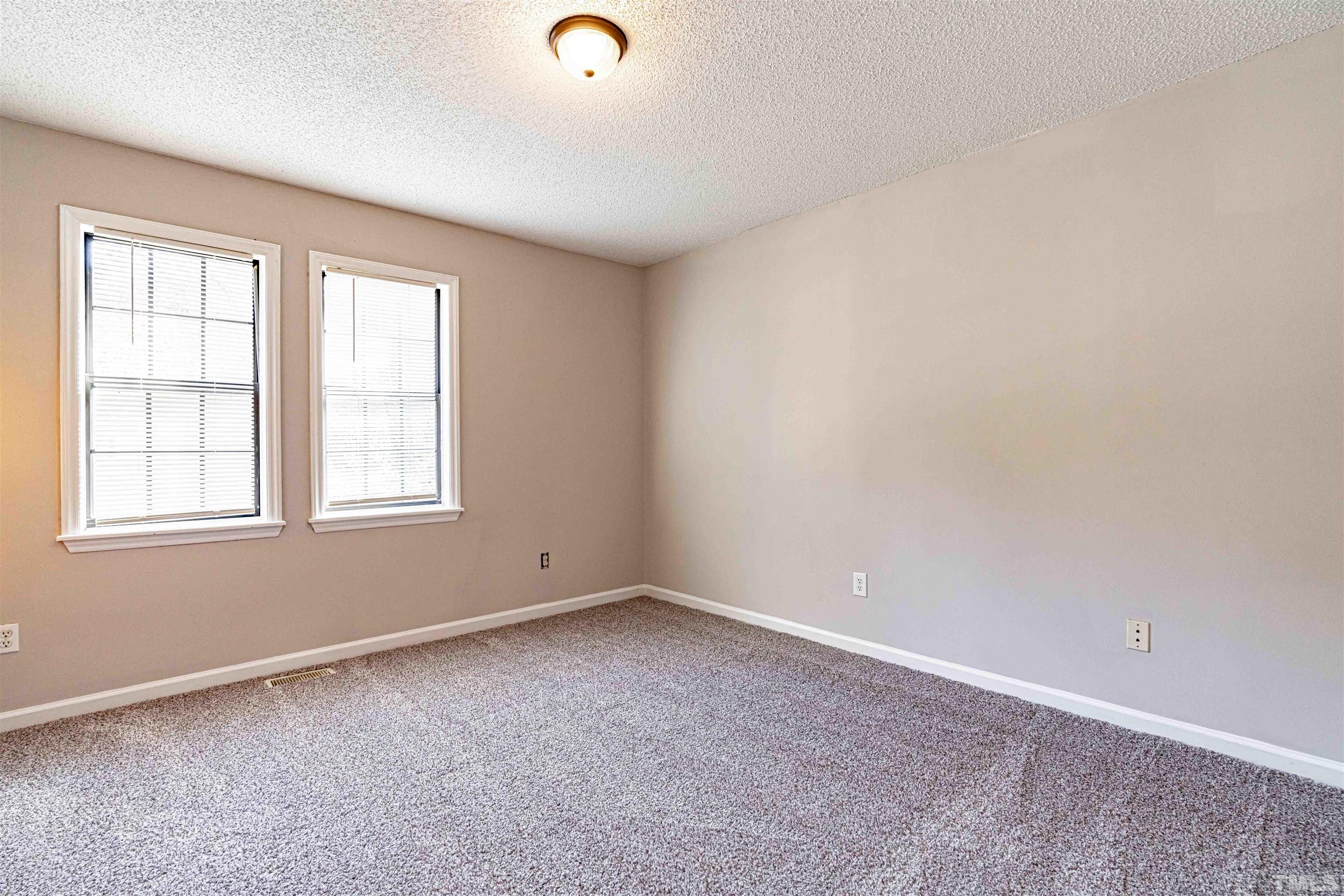 1722 Fox Hollow Drive Raleigh, NC 27610 - Photo 13 of 18 an empty room with windows