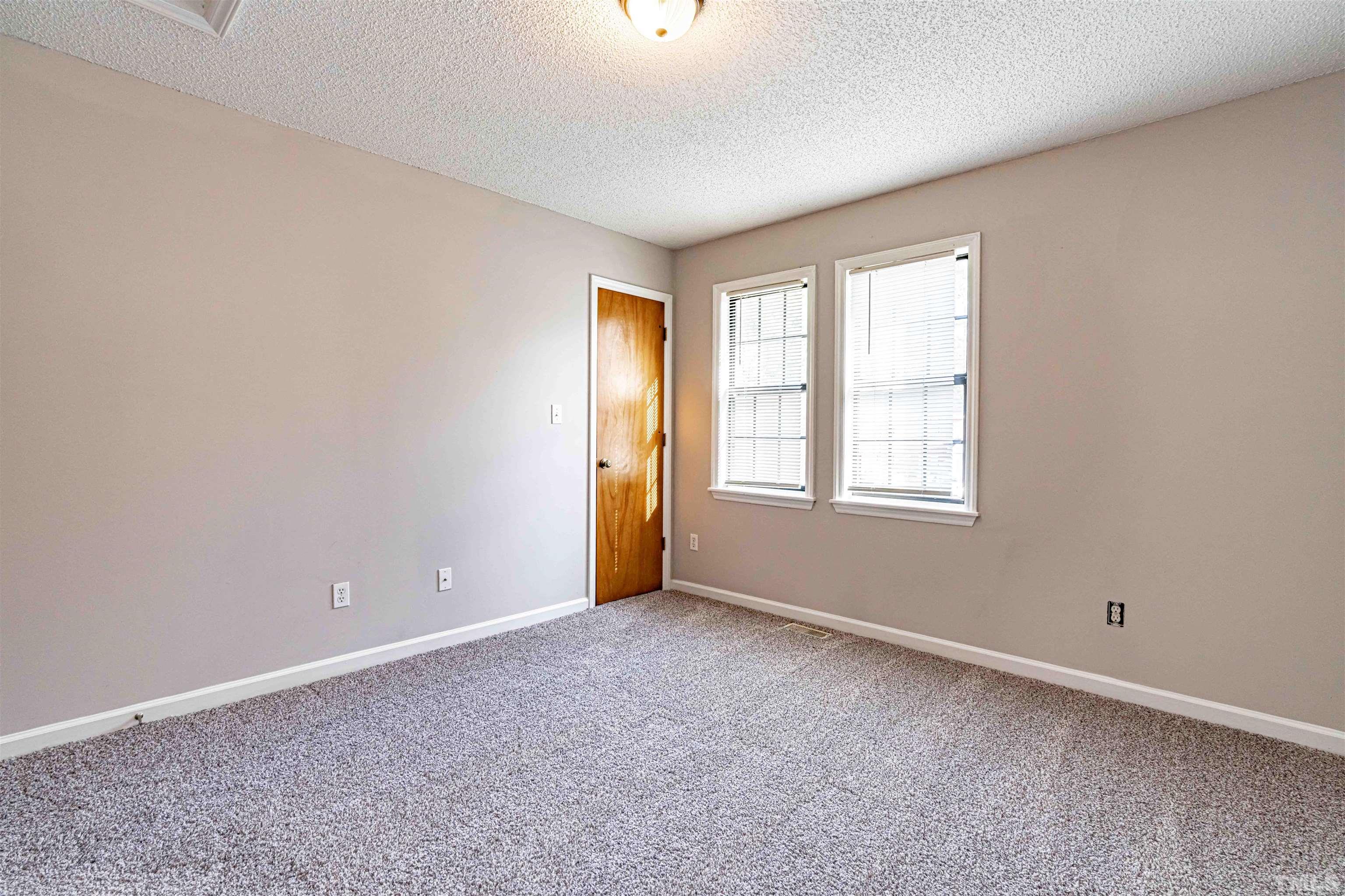1722 Fox Hollow Drive Raleigh, NC 27610 - Photo 14 of 18 a view of an empty room with a window