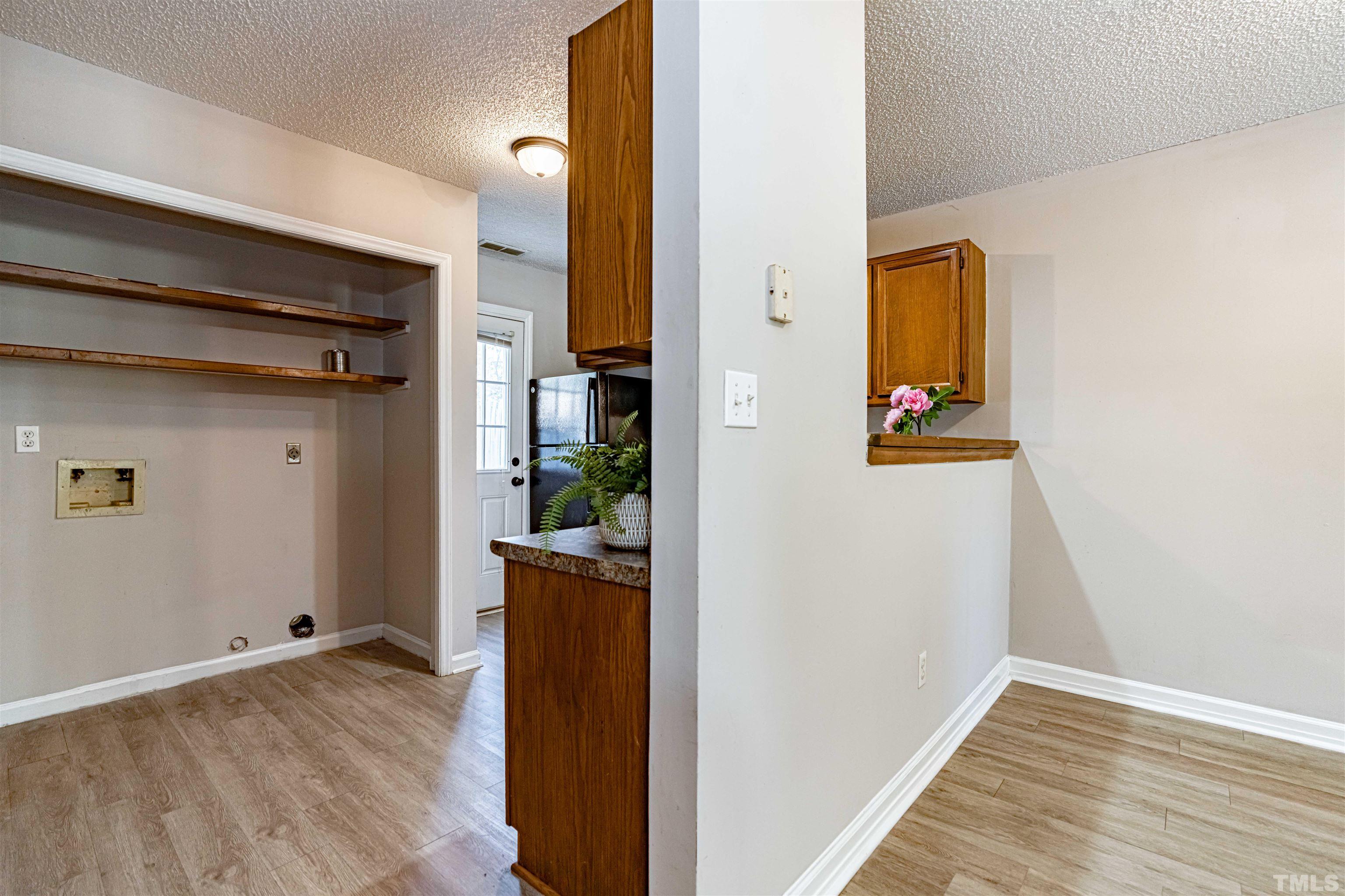 1722 Fox Hollow Drive Raleigh, NC 27610 - Photo 7 of 18 a view of hallway with wooden floor