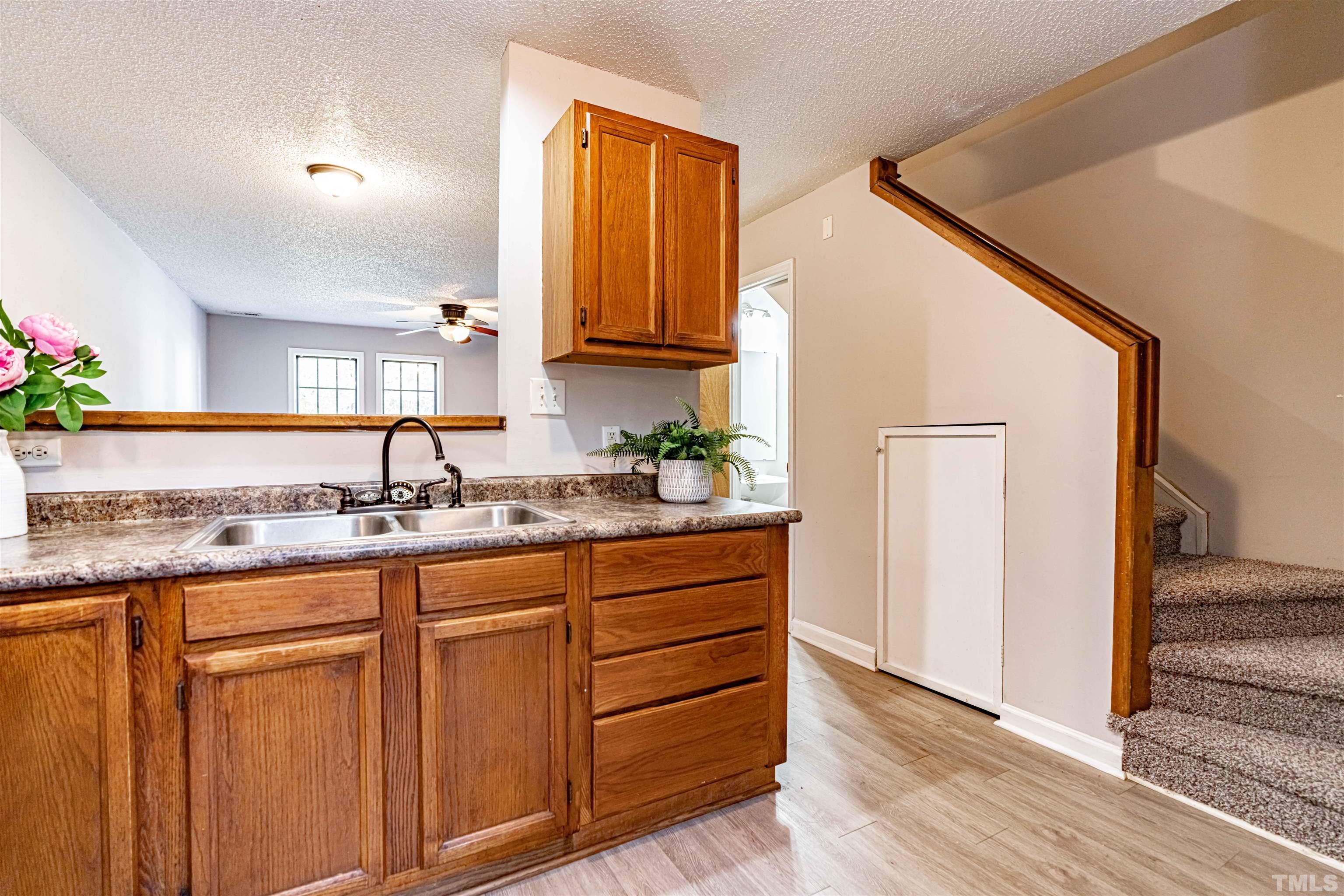 1722 Fox Hollow Drive Raleigh, NC 27610 - Photo 10 of 18 a kitchen with granite countertop a sink and cabinets