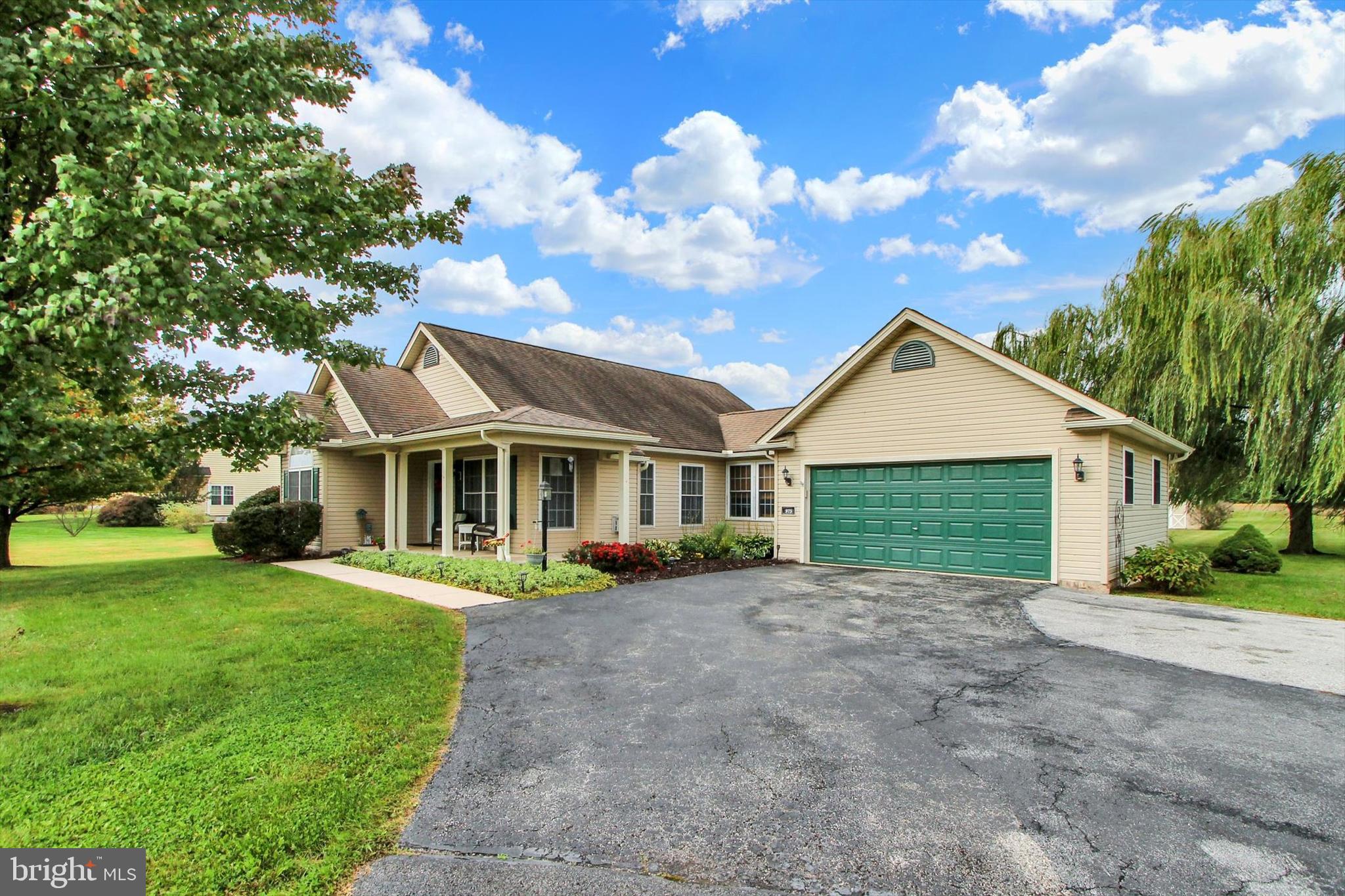 975 Hoffman Home Road Gettysburg, PA 17325 - Photo 2 of 28 a front view of a house with a garden and trees