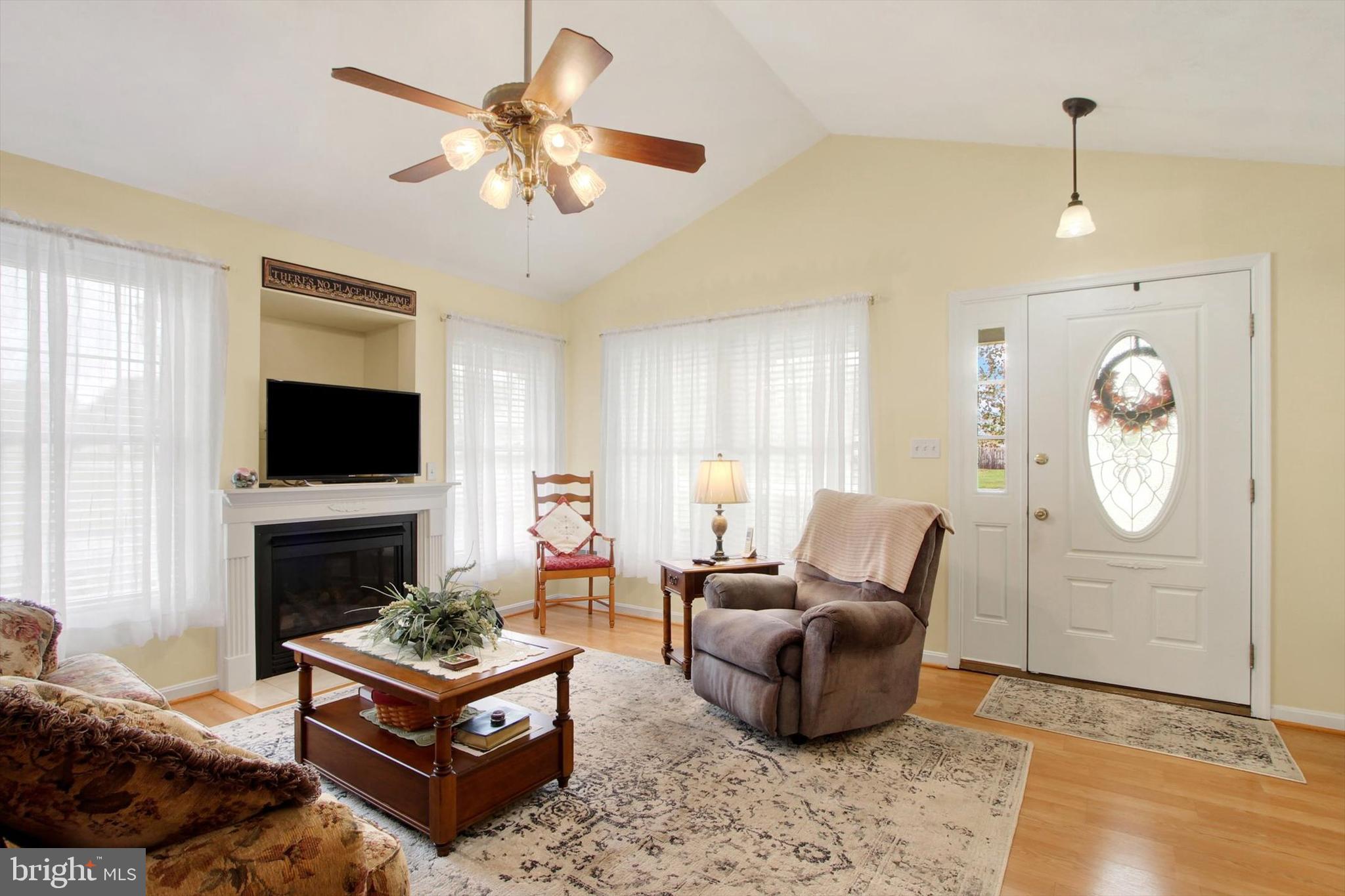 975 Hoffman Home Road Gettysburg, PA 17325 - Photo 3 of 28 a living room with furniture a flat screen tv and a fireplace