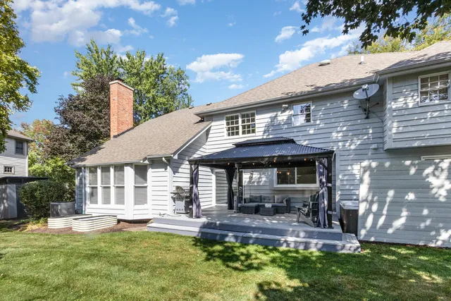 a front view of a house with a yard porch and outdoor seating