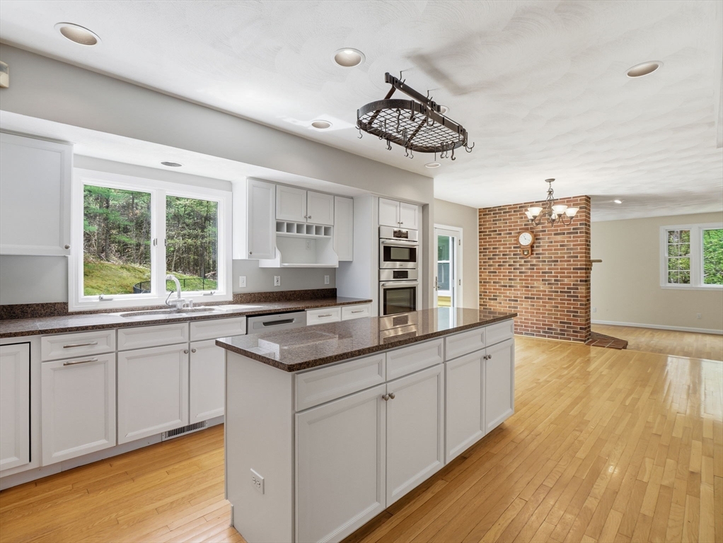 10 Hawk Ridge Road Andover, MA 01810 - Photo 4 of 32 a kitchen with a sink cabinets and window