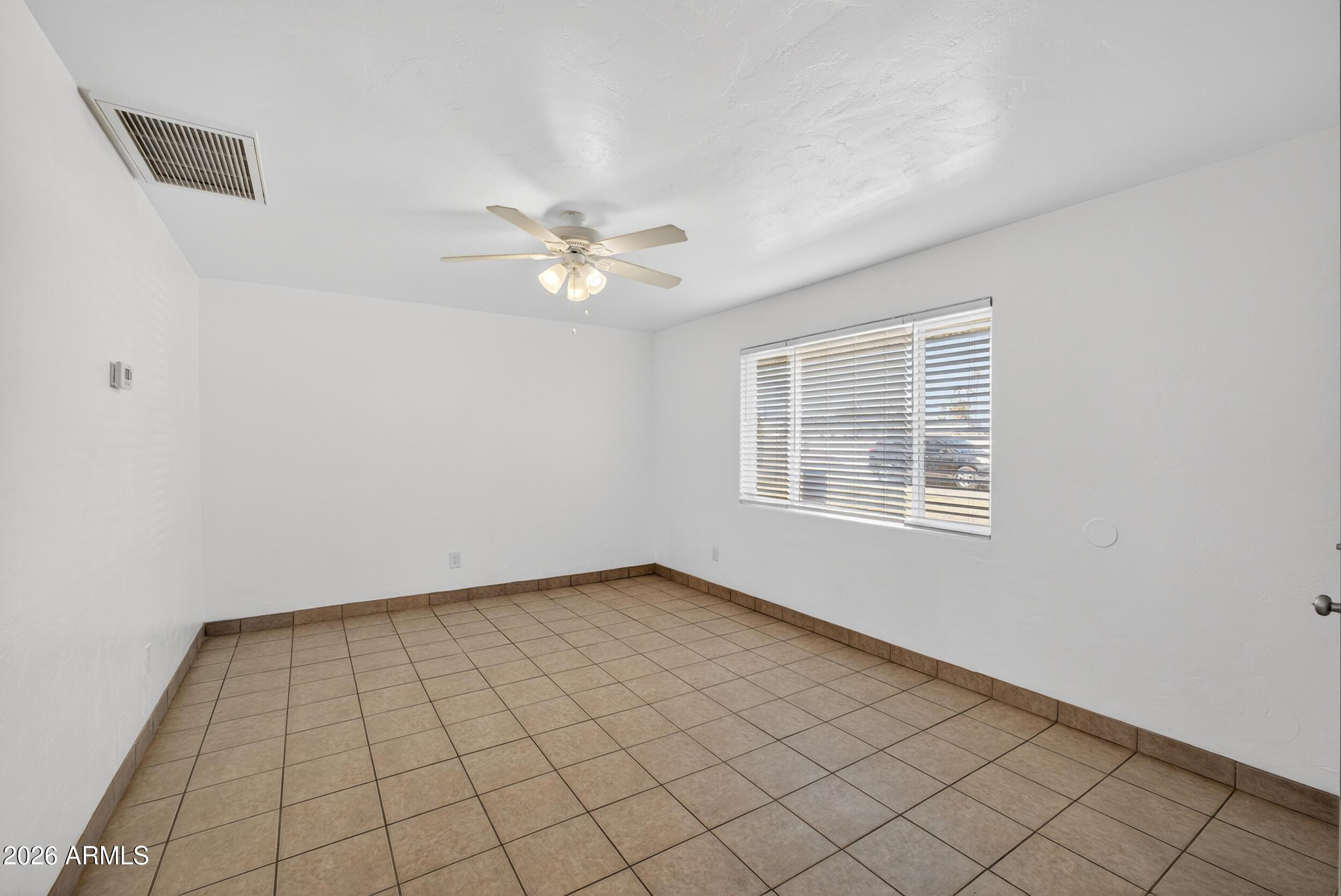 446 South Bellview Mesa, AZ 85204 - Photo 10 of 19 an empty room with windows