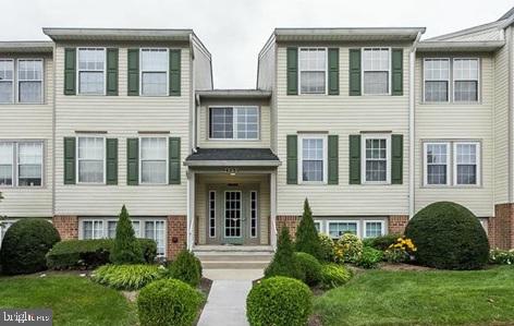 49 Bridle Lane, Unit 55 Nottingham, MD 21236 - Photo 1 of 17 a view of a front of a house with a garden