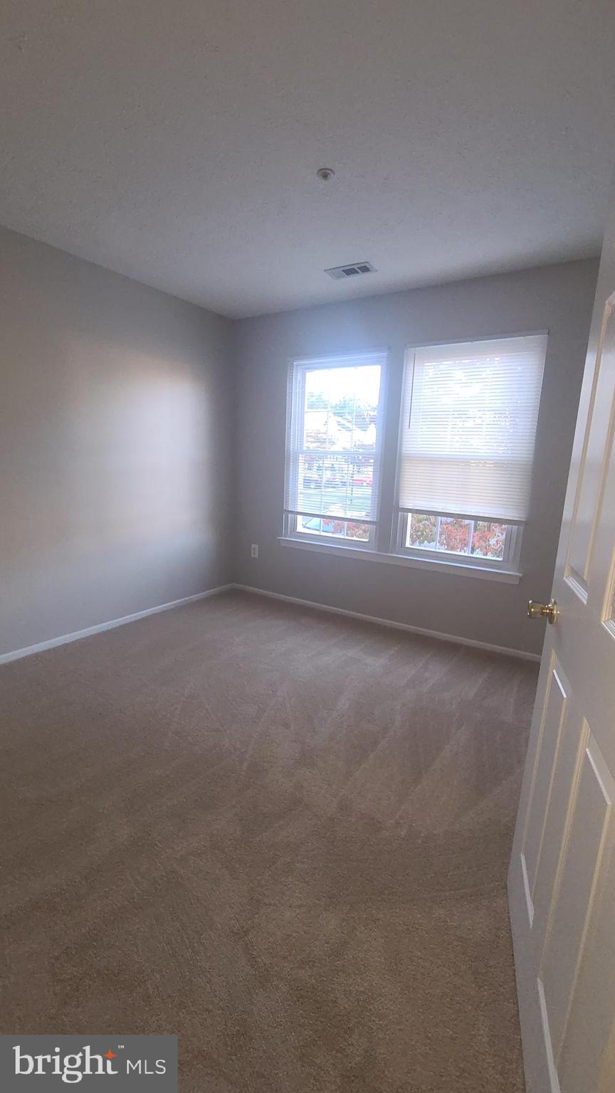 49 Bridle Lane, Unit 55 Nottingham, MD 21236 - Photo 12 of 17 a view of an empty room with a window