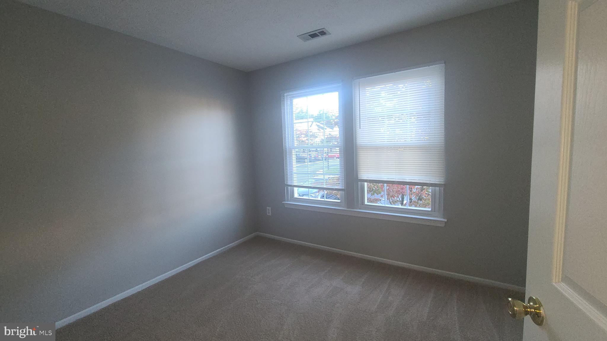 49 Bridle Lane, Unit 55 Nottingham, MD 21236 - Photo 13 of 17 an empty room with a window