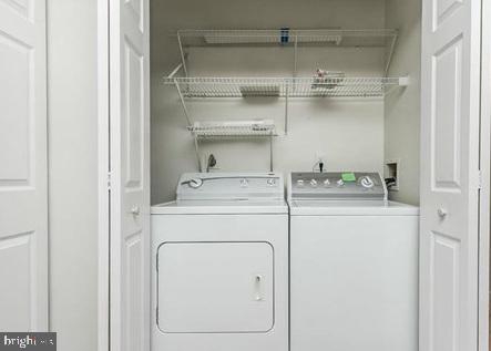 49 Bridle Lane, Unit 55 Nottingham, MD 21236 - Photo 7 of 17 a utility room with dryer and washer