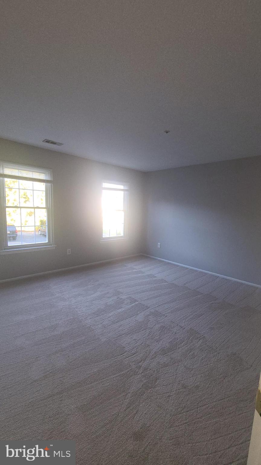 49 Bridle Lane, Unit 55 Nottingham, MD 21236 - Photo 8 of 17 an empty room with windows