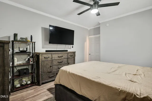 a bedroom with a bed and a dresser