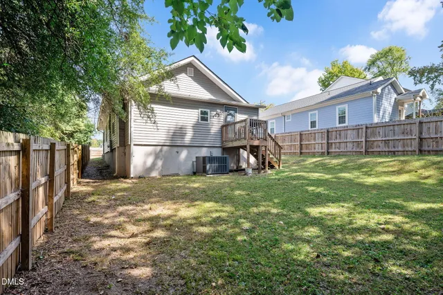 a view of a backyard with a swing