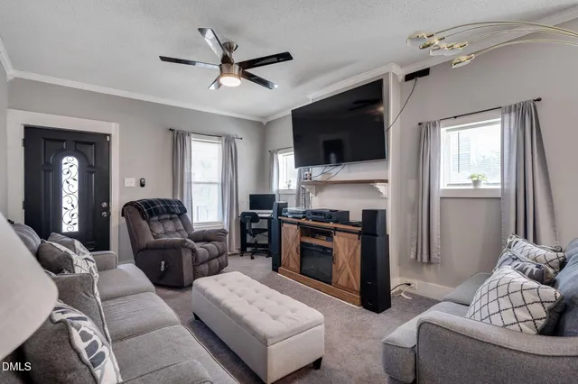 a living room with furniture and a flat screen tv