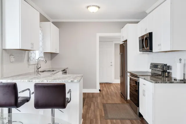 a view of kitchen with cabinets and outdoor view