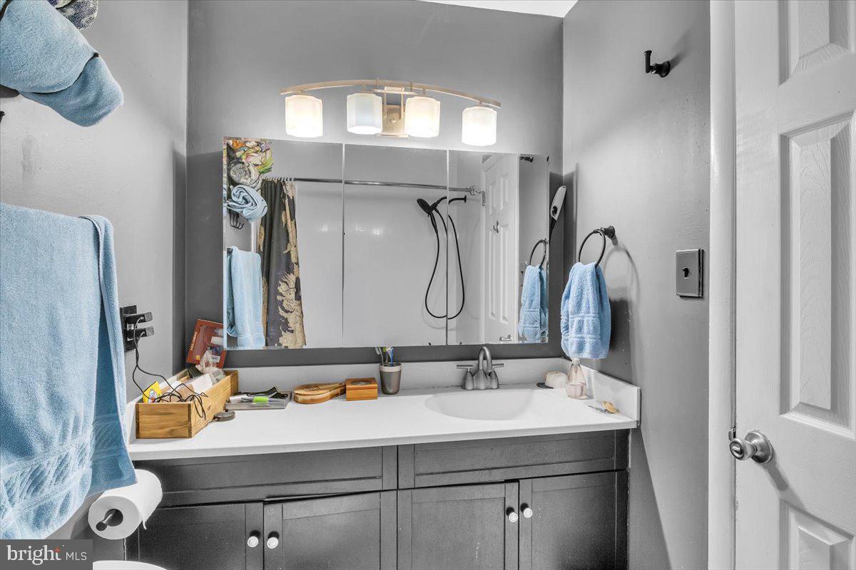 117 Echelon Road Voorhees, NJ 08043 - Photo 16 of 21 a bathroom with a sink vanity and a mirror