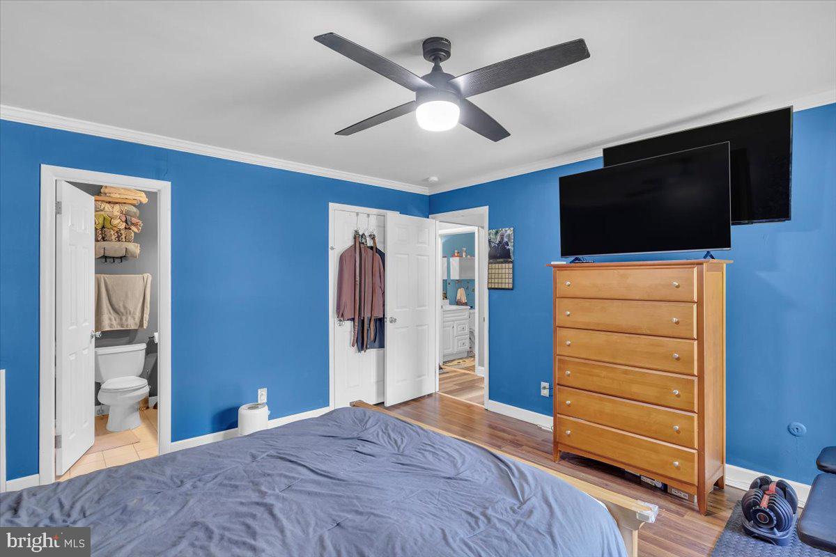 117 Echelon Road Voorhees, NJ 08043 - Photo 17 of 21 a bedroom with a bed and a flat screen tv