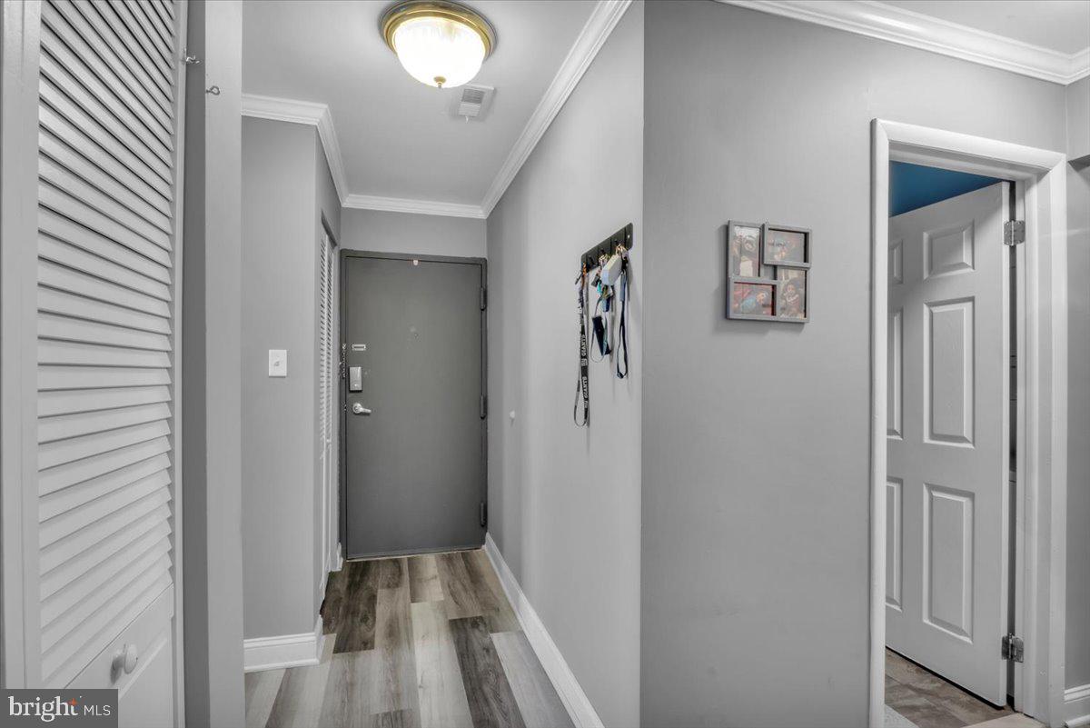 117 Echelon Road Voorhees, NJ 08043 - Photo 2 of 21 a view of a hallway with wooden floor and a bathroom