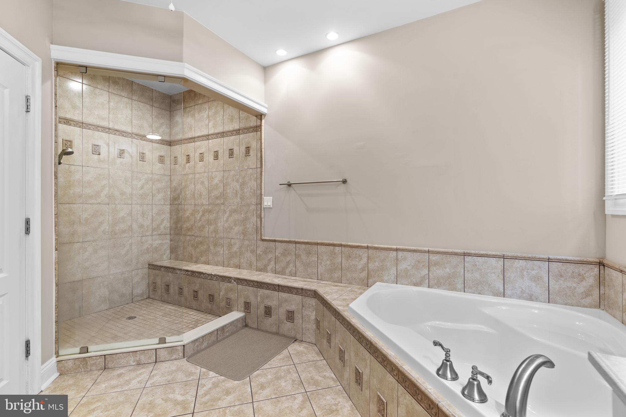 8024 Solley Road Glen Burnie, MD 21060 - Photo 39 of 83 a bathroom with a bathtub and shower
