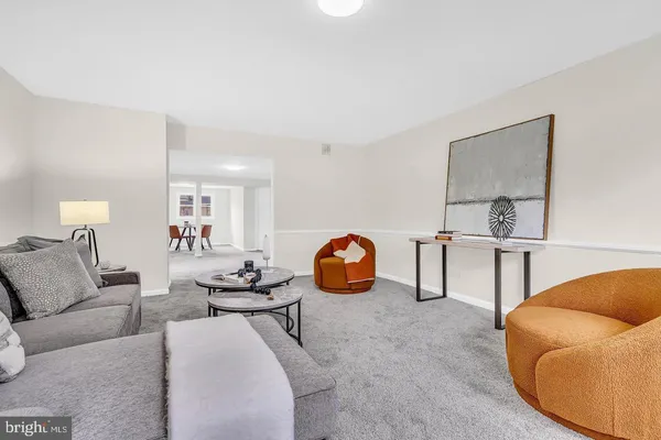 a living room with furniture and a table
