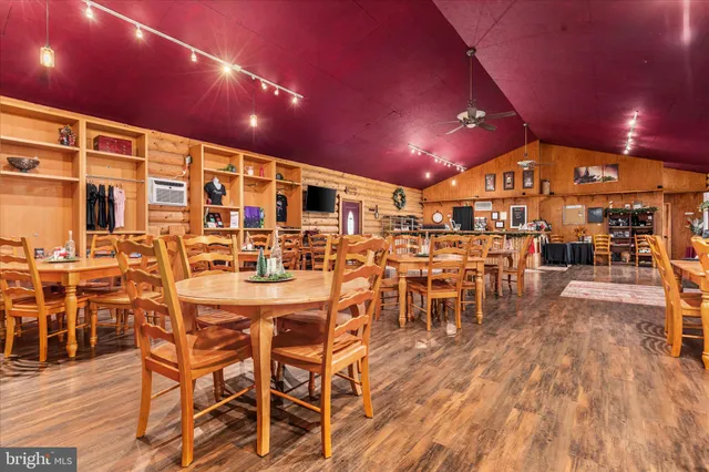 a view of hallway with furniture and a window